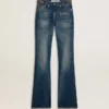 Blugi pentru femei cu croială bootcut, spălare vintage și detalii metalice