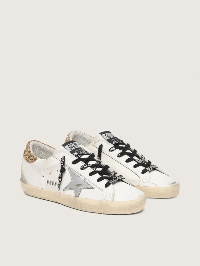 Adidași Super-Star din piele albă pentru femei, cu bandă strălucitoare pe călcâi