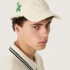 Șapcă de baseball crem cu patch „auriu” ton pe ton și insignă verde în formă de stea