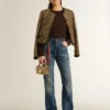 Blugi pentru femei cu croială bootcut, spălare vintage și detalii metalice