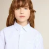 Cămașă în dungi pentru fete, cu inscripție brodată pe buzunar