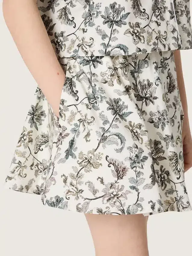 Fustă mini pentru fete „Journey” din pânză de bumbac albă cu imprimeu floral verde