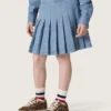 Fustă mini plisată pentru fete „Journey”, din bumbac chambray albastru deschis, cu logo brodat