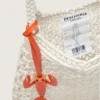 Geantă de damă din bumbac de culoarea untului, cu macrame și un pandantiv din piele în formă de homar