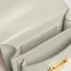 Geanta Venezia mică din piele cu textură, de culoare gri mineral, cu detalii aurii