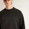 Hanorac unisex din bumbac negru cu aspect uzat, cu logo brodat