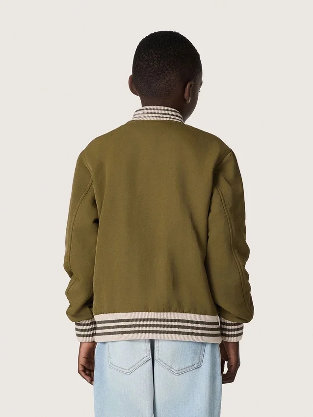 Jachetă bomber unisex Journey din sargă de nailon verde militar cu patch brodat