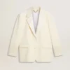 Jachetă oversize cu un singur rând de nasturi, de culoare albă, cu efect de mătase și broderii