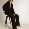 Modelul Ball Star pentru femei din piele nappa neagră, cu stea neagră cu sclipici și bandă din piele de căprioară pe călcâi