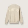 Pulover unisex cu guler rotund din bumbac bej, cu patch pe partea din față și logo pe spate