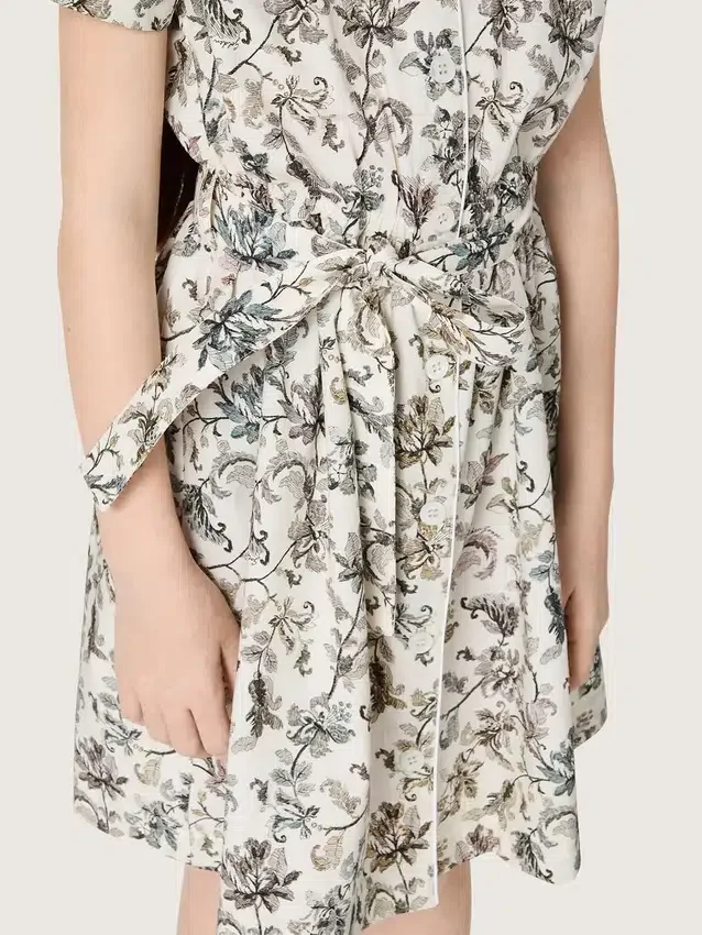 Rochie pentru fete „Journey” din pânză de bumbac albă cu imprimeu floral verde