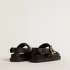 Sandale Lucy pentru femei din piele neagră lucioasă, cu cataramă metalică aurie