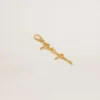 Talisman din alamă de culoare aurie cu semnătura golden goose